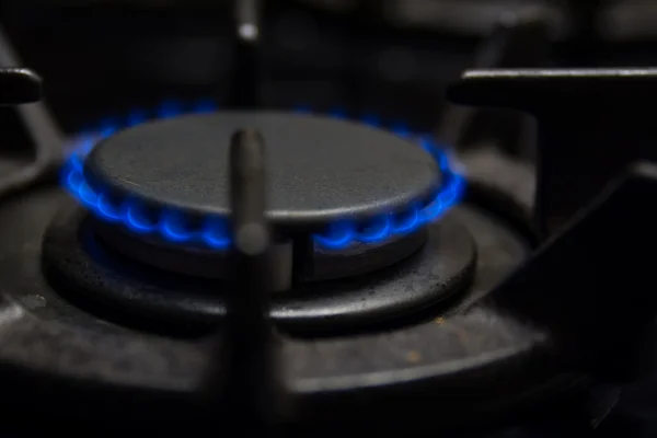 Gas stove blue flames — Stock Photo, Image