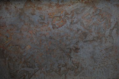 Kahverengi pas lekeli gri metal yüzey