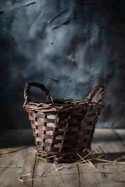 Small wicker basket on a wooden table