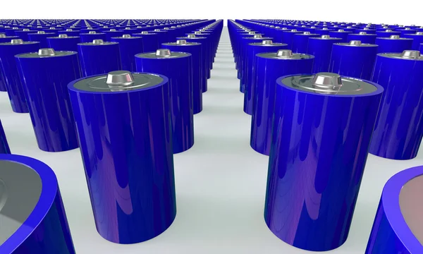 Uma matriz de baterias azuis isoladas em branco — Fotografia de Stock