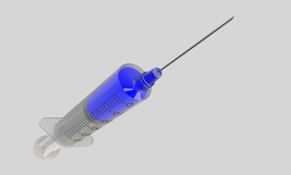 A syringe with fluid  isolated on white