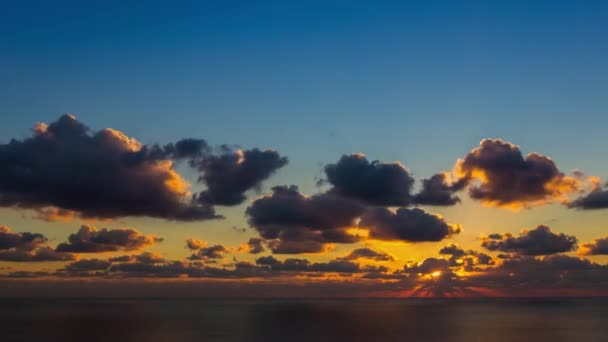 Timelapse movie of clouds at sunset above the sea — Stock Video