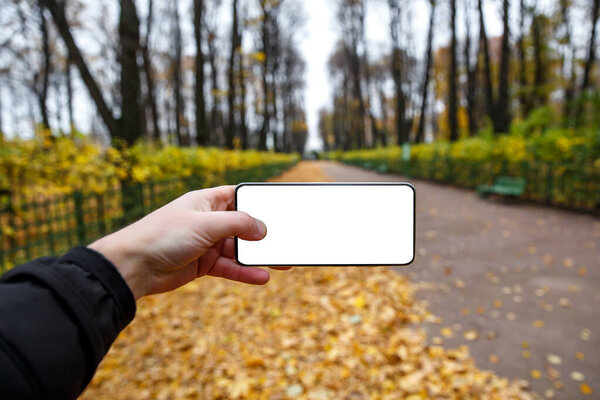 Using smartphone outdoor mockup.