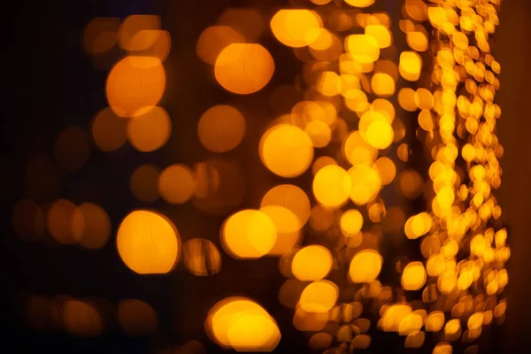 Abstrakter Hintergrund mit Bokeh defokussierten orangen Lichtern. — Stockfoto
