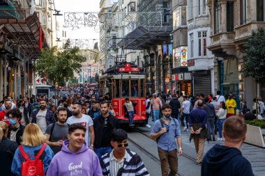 Istanbul, Turkey - April 06, 2022: Old-fashioned red tram on Istiklal Street