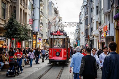 Istanbul, Turkey - April 06, 2022: Old-fashioned red tram on Istiklal Street