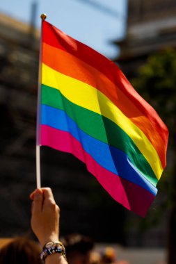 Lgbt pride rainbow flag during parade in the city