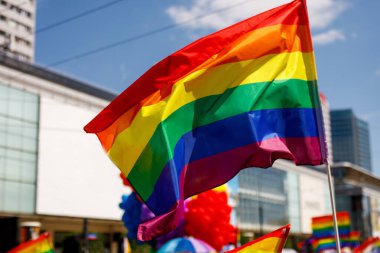 Lgbt pride rainbow flag during parade in the city