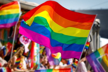 Lgbt pride rainbow flag during parade in the city