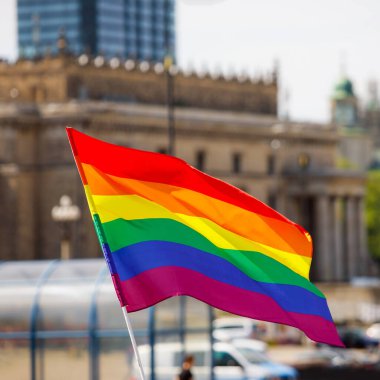 Lgbt pride rainbow flag during parade in the city