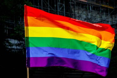 Lgbt pride rainbow flag during parade in the city