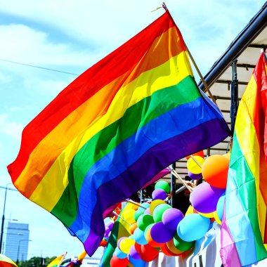 Lgbt pride rainbow flag during parade in the city