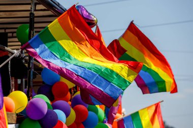 Lgbt pride rainbow flag during parade in the city