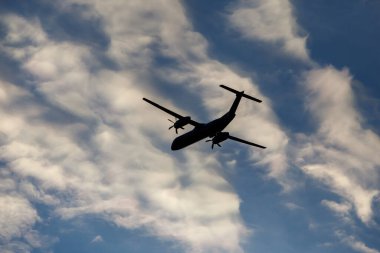 Turboprop air plane with propellers flying in the sky