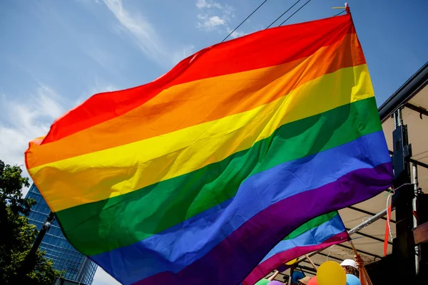 Lgbt pride rainbow flag during parade in the city