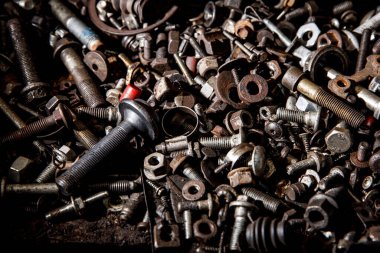 Set of the female screw and bolts. Iron texture background