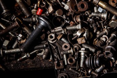 Set of the female screw and bolts. Iron texture background