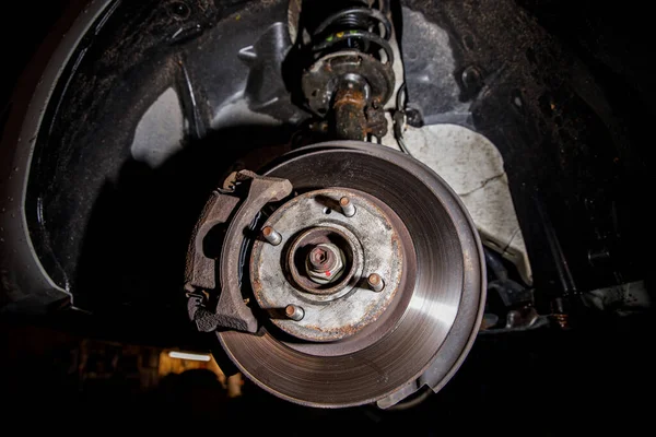 Disc brake of the vehicle for repair. Car on a lift