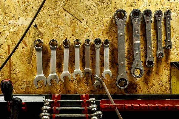 Set of wrenches hanging on the wall