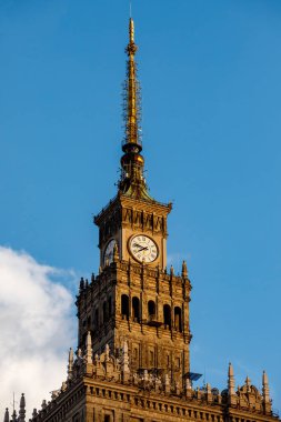 The clock tower of the Palace of Culture and Science in Warsaw, Poland