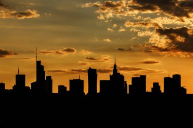 Silhouette of the city skyline during a beautiful sunset. Cityscape under the clouds