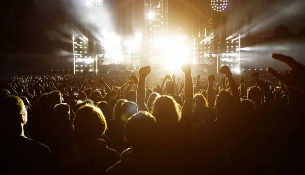 Lot People Raised Hands Concert Event Fans Arms Stage Light — Stockfoto