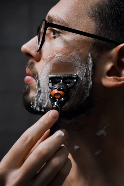 Portrait Young Handsome Man Glasses Shaves Bathroom Work Profile Serious — Stock Photo, Image