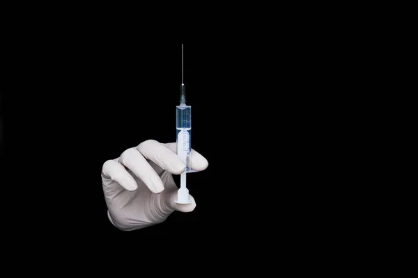 Doctor White Gloves Holds Syringe Vaccine Black Background Close Hands — стоковое фото