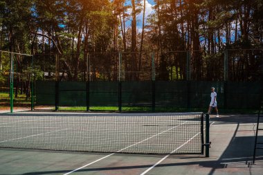 young male athlete playing tennis