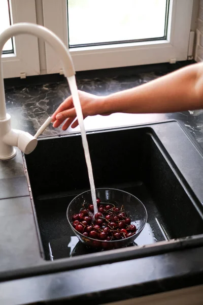 Young Woman Washing Cherries Home Running Water Make Juice — 스톡 사진