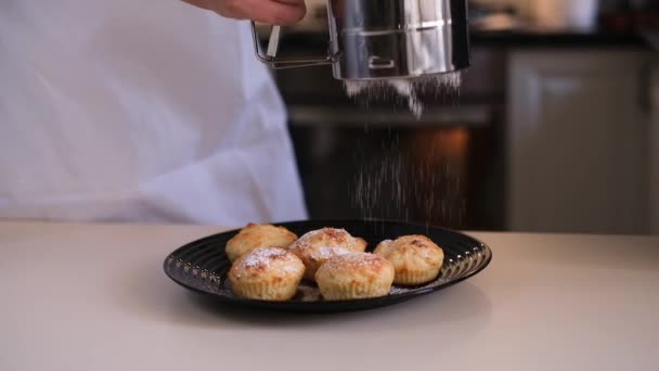 Woman Sprinkles Cupcakes Powdered Sugar Kitchen Close Chef Preparing Dessert — Stock Video