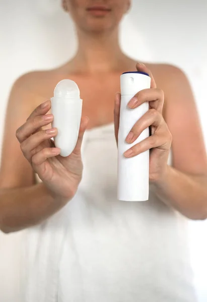 Woman Holding Roll Deodorant Antiperspirant Spray — стоковое фото