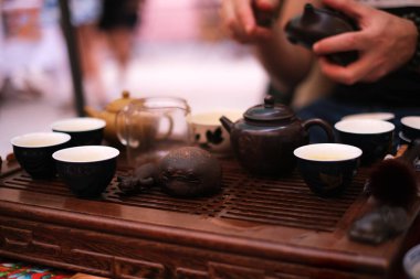 master at the tea ceremony pours tea close-up
