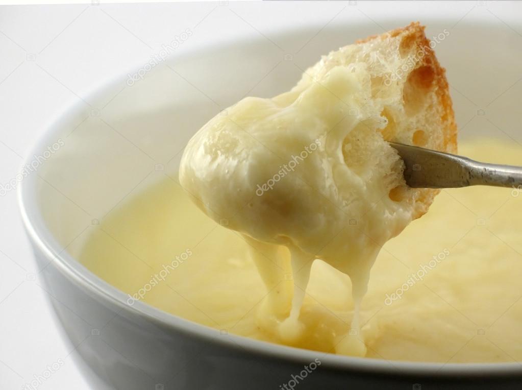 Cheese fondue half dipped