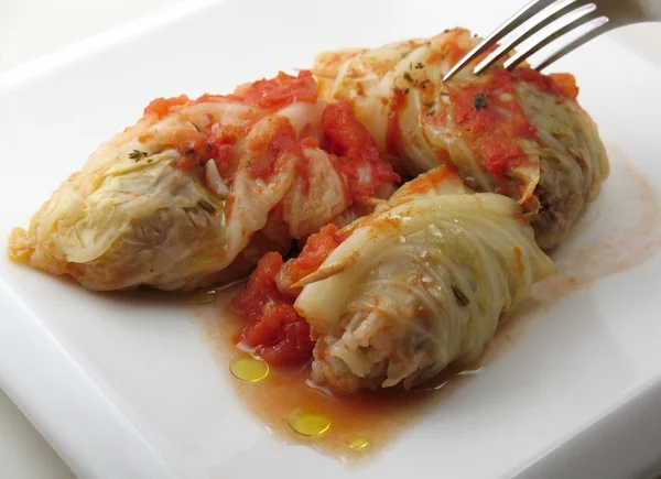 Fork in cabbage rolls — Stock Image Fork in cabbage rolls Stock Photo