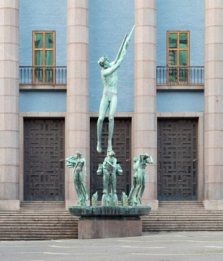 Stockholm, Sweden - June 26 2022: Bronze Orpheus Fountain sculpture, by Carl Milles,1936, located in front of the Blue Stockholm Concert Hall building, or Stockholms konserthus, Hotorget Square