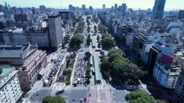 Landmark Avenue Buenos Aires Argentina. Panning wide landscape of tourism landmark downtown of capital of Argentina. Tourism landmark. Outdoors downtown city. Urban scenery of Buenos Aires city.