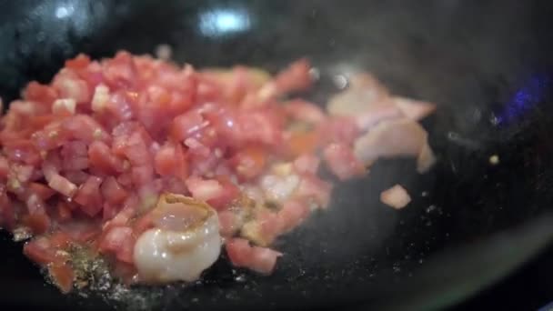 Frying chopped onions, and bacon in a frying pan — Stock Video