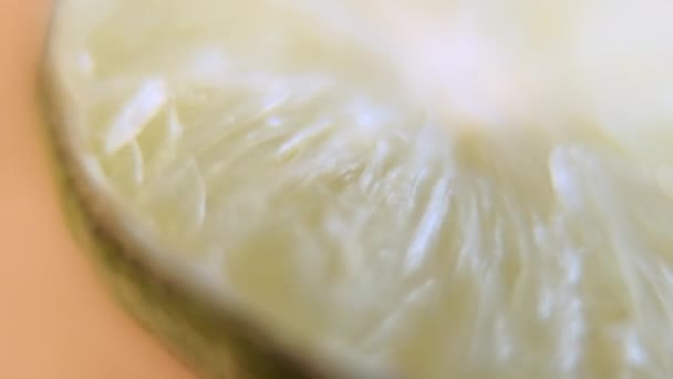Close-up of a fresh and blurry halved lime — Stock Video