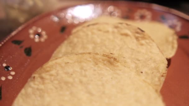 Clay bowl of delicious and traditional Mexican pozole on wooden table — Stock Video