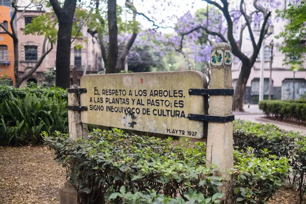 Stone sign in Spanish in park from Mexico City