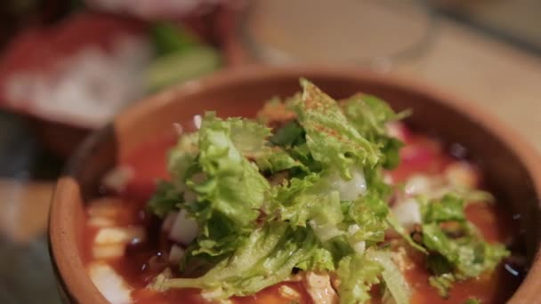 Clay bowl of delicious and traditional Mexican pozole — Stock Video