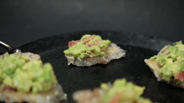 Pork rinds with guacamole on traditional Mexican comal — Stock Video