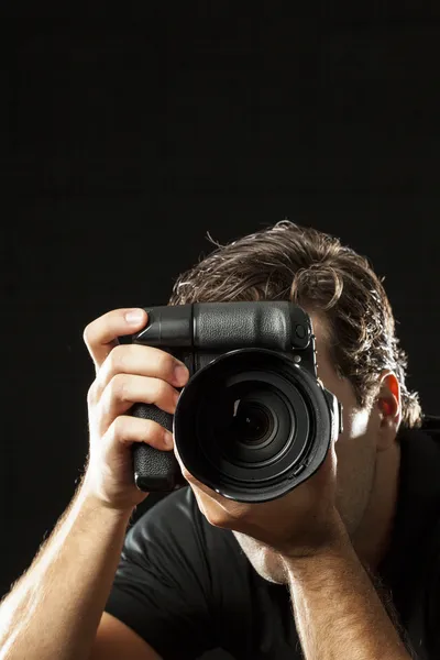 Photographer on black. — Stock Photo, Image