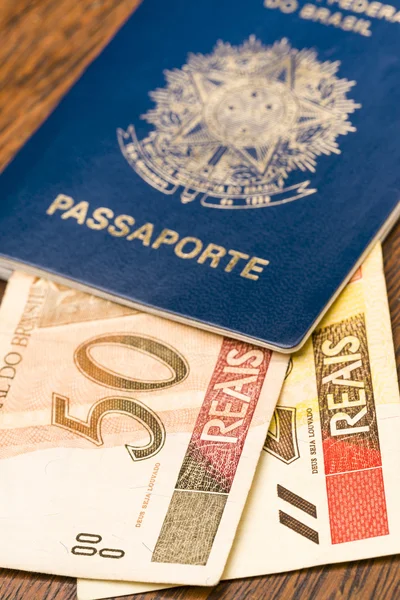 Brazilian Passport with real bills — Stock Photo, Image