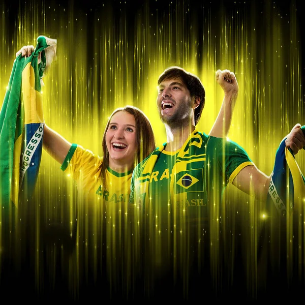 Brazilian Couple Celebrating Cup Black Background Yellow Glow Cheering Brazil — Stock Photo, Image