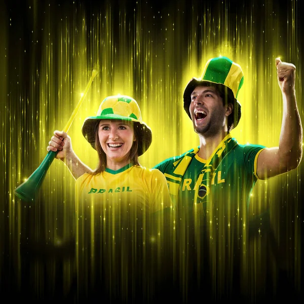 Brazilian Couple Celebrating Cup Black Background Yellow Glow Cheering Brazil —  Fotos de Stock