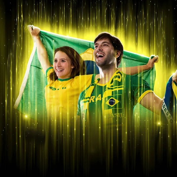 Brazilian Couple Celebrating Cup Black Background Yellow Glow Cheering Brazil — Zdjęcie stockowe