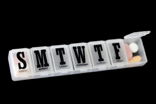 Daily pillbox with pills inside — Stock Photo, Image