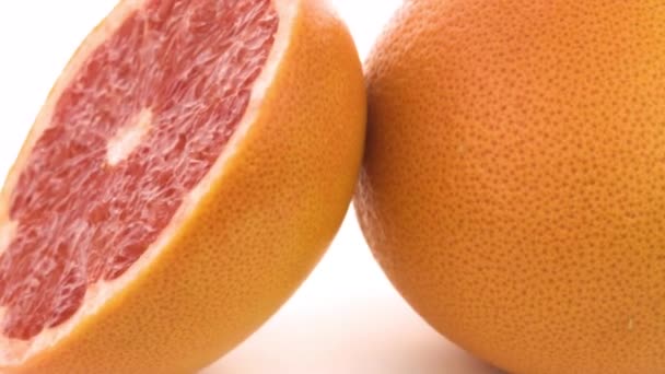 グレープフルーツは単離される 白い背景に黄色のレモン 柑橘類 — ストック動画